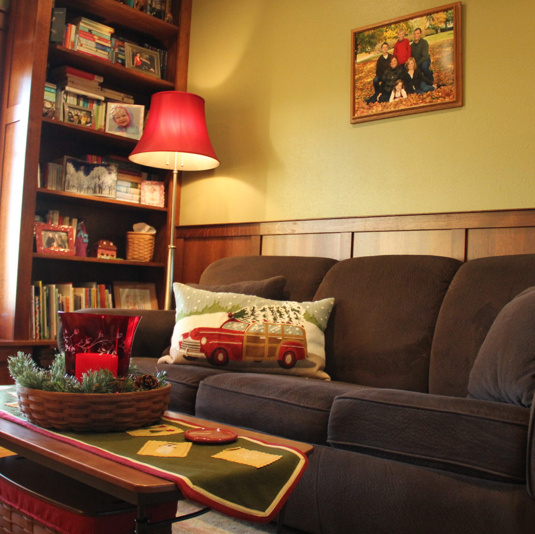 For the den I keep it cozy with a cute winter pillow cover, a red Longaberger vase with automatic candle that gives just the right amount of light.