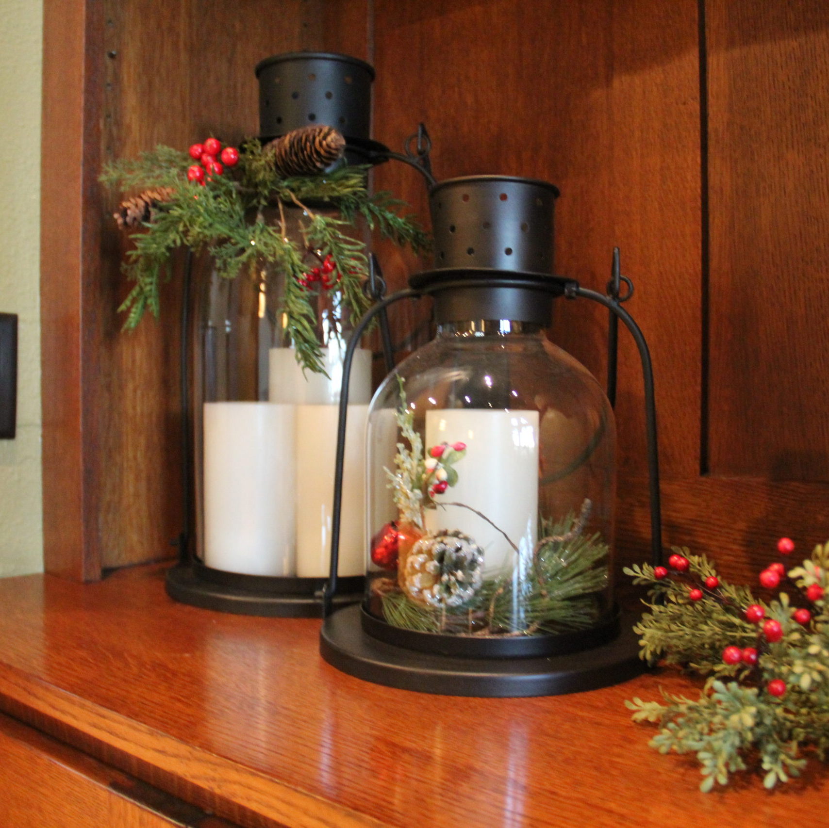 Pottery Barn lanterns and automatic candles. I love these during the holidays with holiday greenery sticks wrapped around the base of the candle or the neck of the lantern.