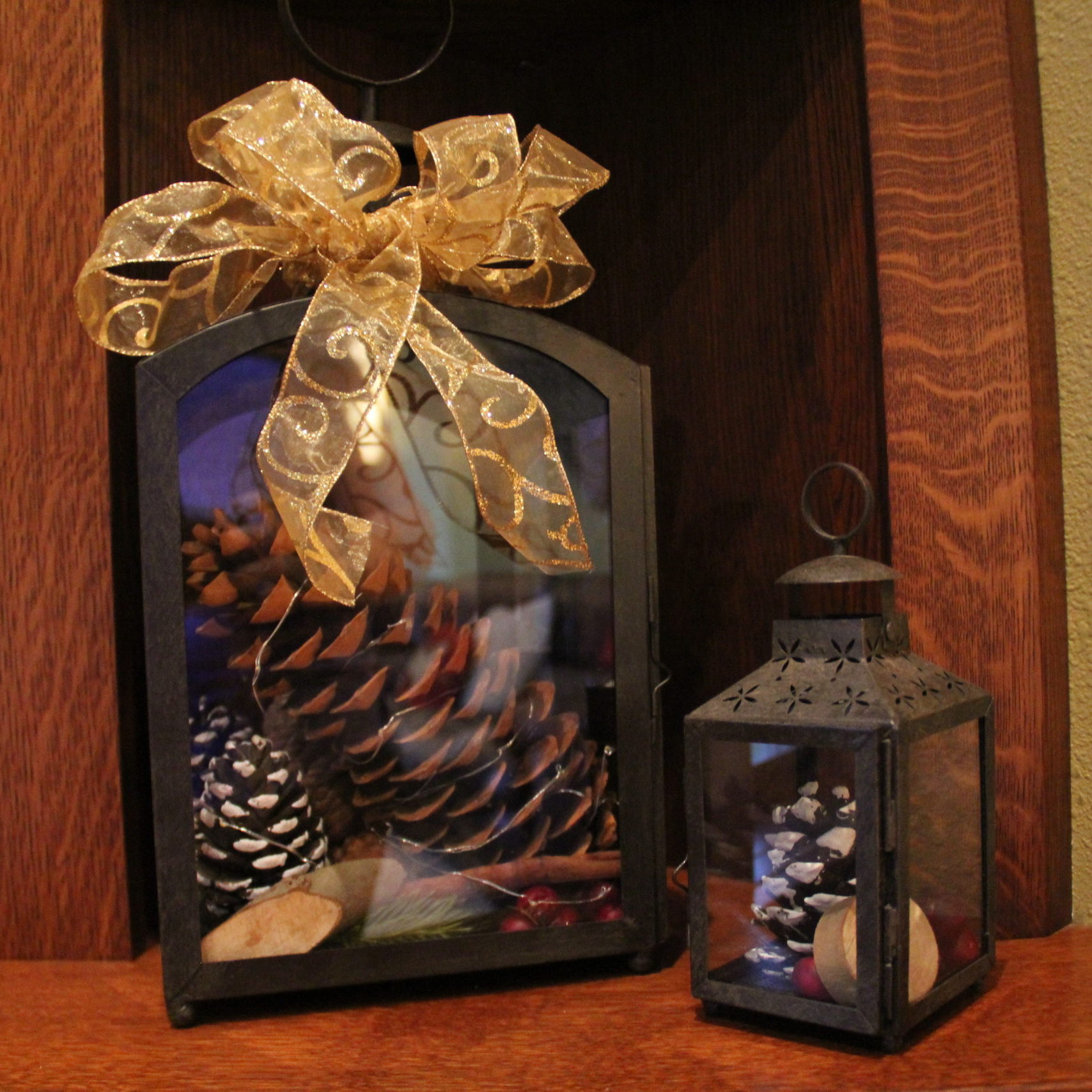 Lanterns are not just for candles. This Pottery Barn one looks good with a giant pinecone wrapped in small LED battery operated lights.