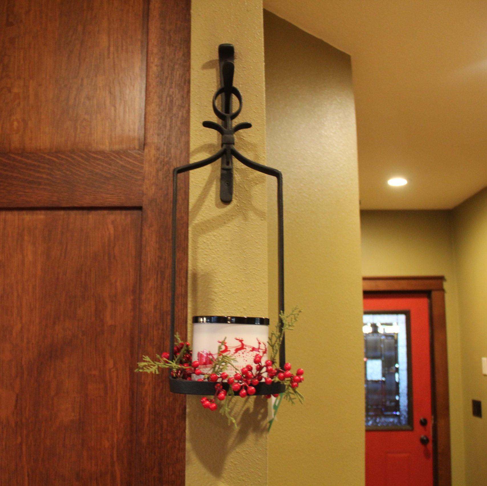 This candle holder used to have a glass sleeve until a couple of kids broke it so now it holds scented candles that fill the back hall with smells of the season.