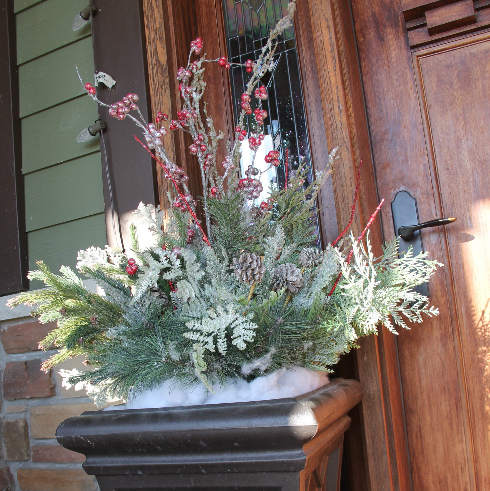 For the planters I went to a craft store for floral and a large square foam piece to arrange everything in. It all sits down inside with a white garbage bag that pulls it all up and covers it for storage.