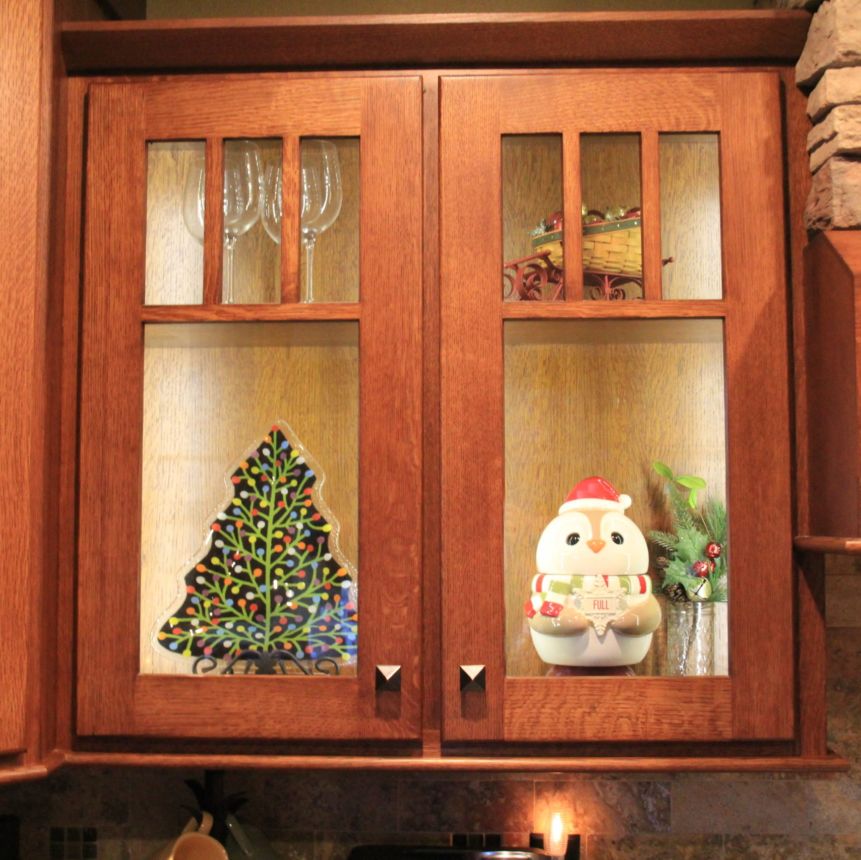 My glass display shelving is adjustable and for the holidays I remove a shelf. I found my owls in Holiday dress and with a Peggy Karr plate and Longaberger sleigh this looks cute together.