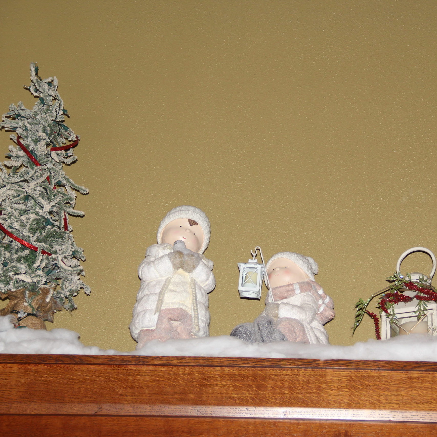 For the other side a couple of more kid statues, lanterns in white from Pier One and a smaller flocked pine from Earthly Blessings.