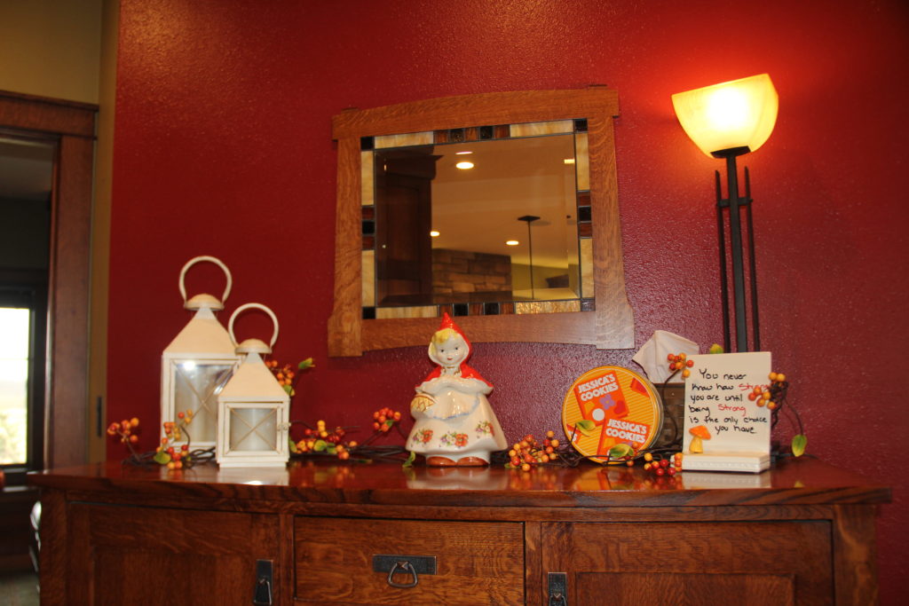 The sideboard gets a nice refresh. The antique cookie jar from my Great Grandma's house, the cookie tin from my Grandma, add in the lanterns, Nora Fleming and the bendable sprigs with orange.