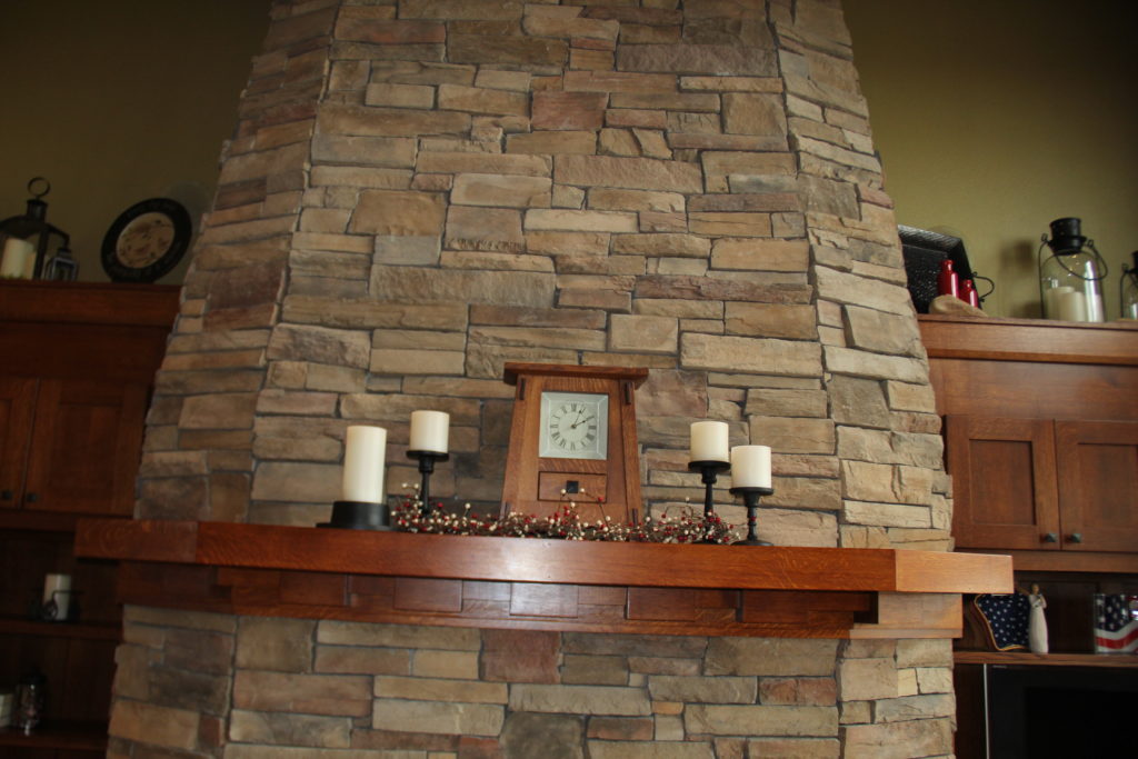 The mantle gets a new sprig of color and the candles remain.