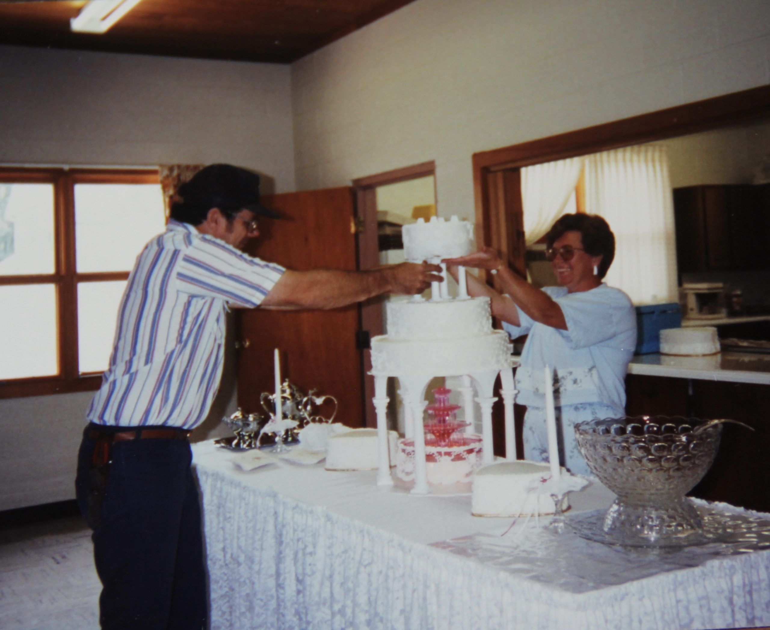 Ben and Cecilia putting the cake together.