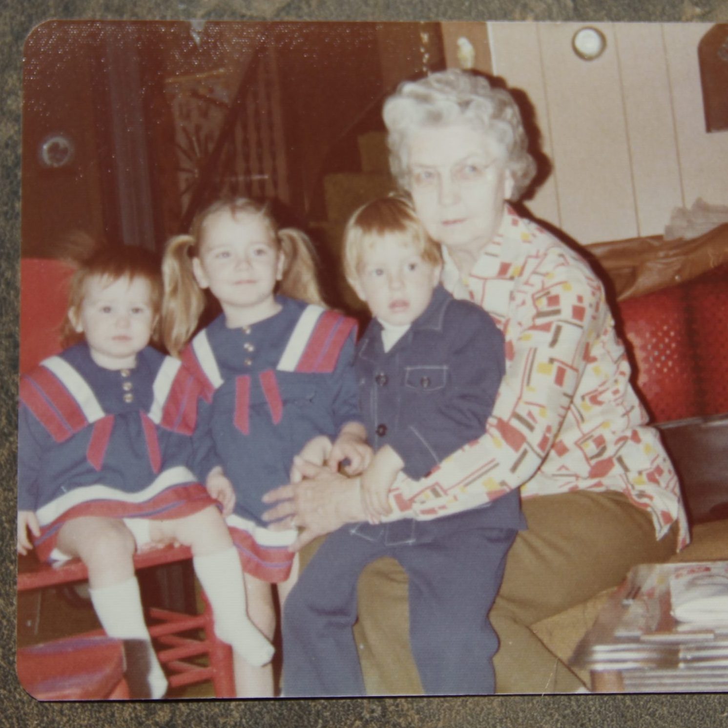 Cora with her grandchildren, my cousin Christopher on her lap, my sister Niccole in pigtails and me.