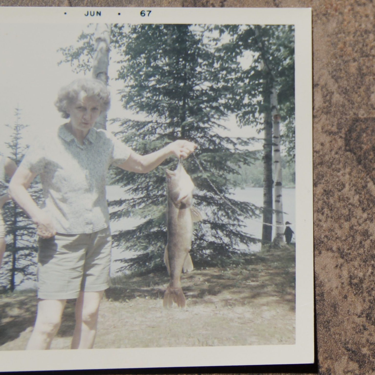 Cora at the cabin with her catch of the day.