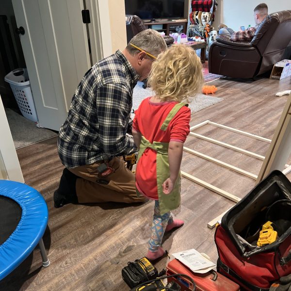 Hadley helping Papa with the bookcase