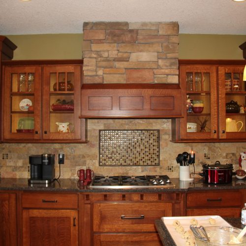 Back wall of the kitchen using the same stone as our fireplace, downstairs bar and exterior of the house.