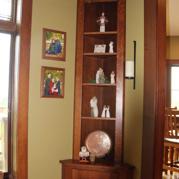 This custom built in mimics the built ins that flank the fireplace. It has adjustable shelving as well and the cupboard is perfect for cards, dice games and more.