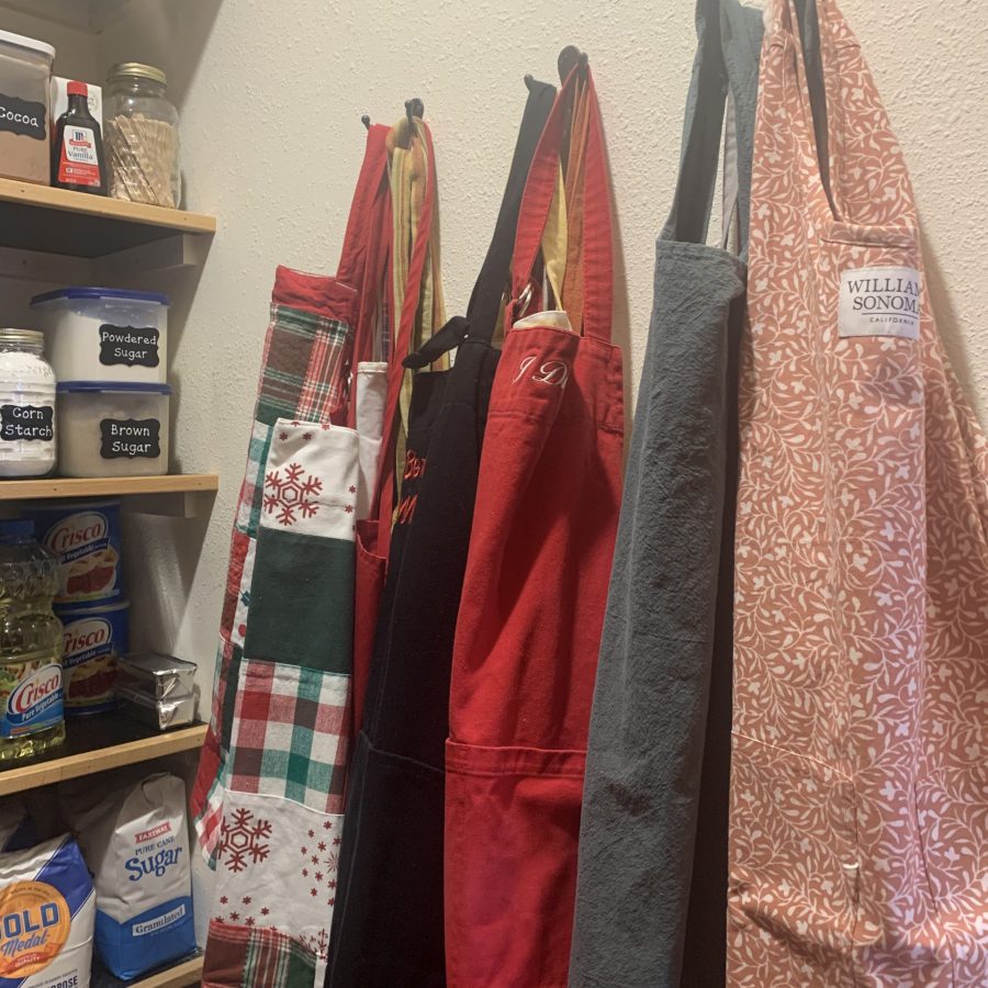 I love my aprons and have many. Lining them up on the side wall on hooks makes them easy to get to