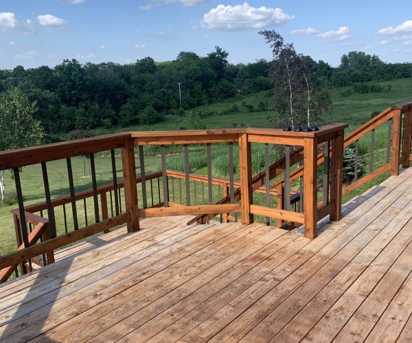 A better view of all the difference of a fresh coat of stain on railing vs stripped floors