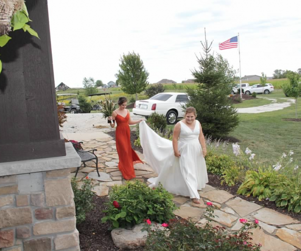 2018, the landscaping never looked more beautiful with our girls walking down the path.